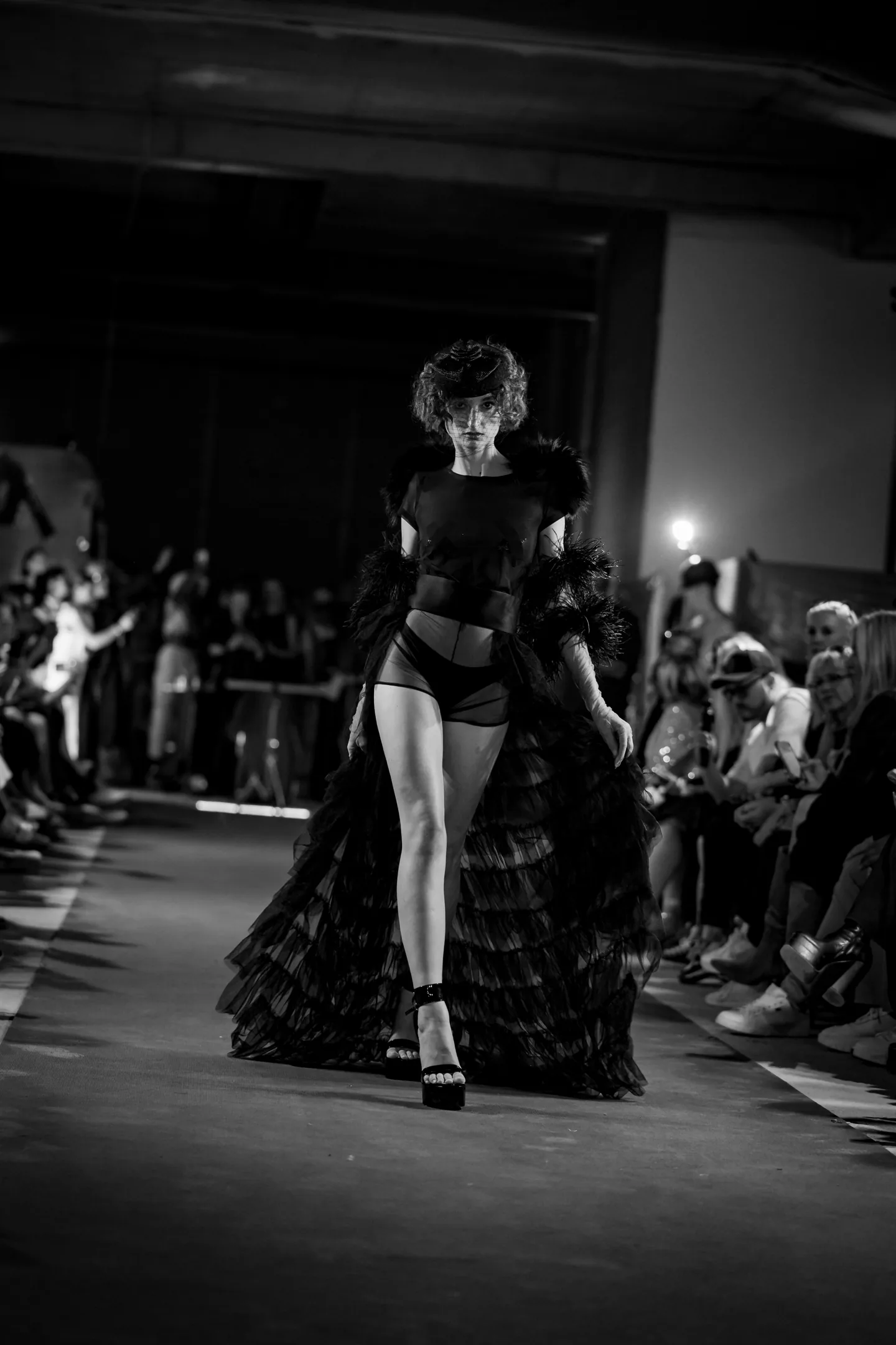 Runway portrait in sculptural couture.