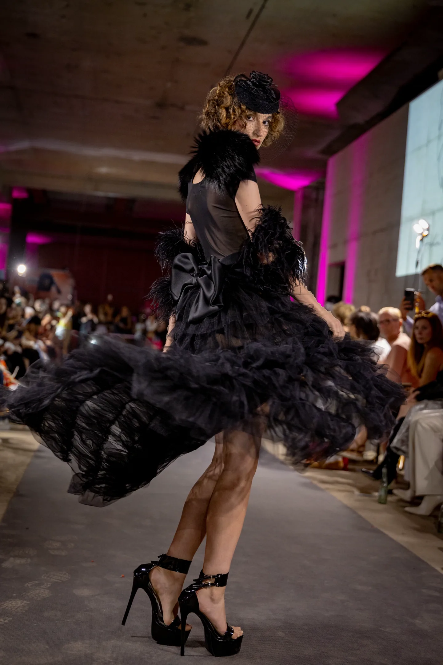 Runway look with dramatic sleeves and a confident stride.